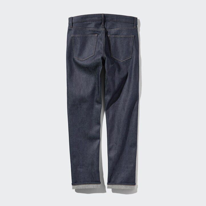vaqueros ajustados elásticos con orillo de uniqlo para hombre color negro