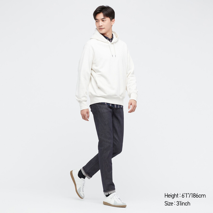 vaqueros ajustados elásticos con orillo uniqlo para hombre color azul marino