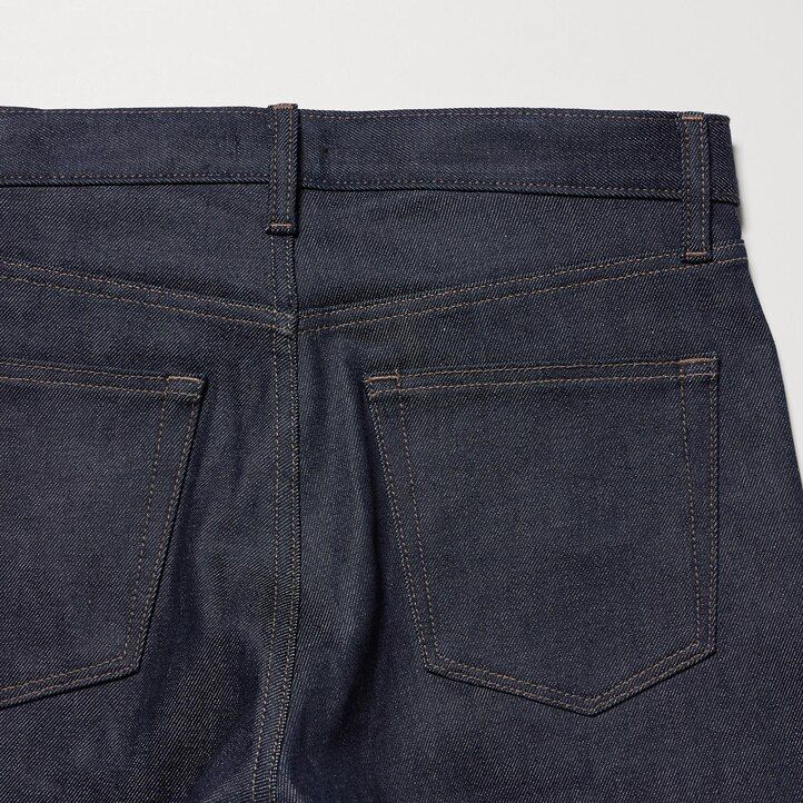 vaqueros ajustados elásticos con orillo uniqlo para hombre color azul marino