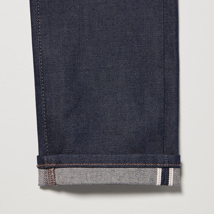 vaqueros ajustados elásticos con orillo uniqlo para hombre color azul marino