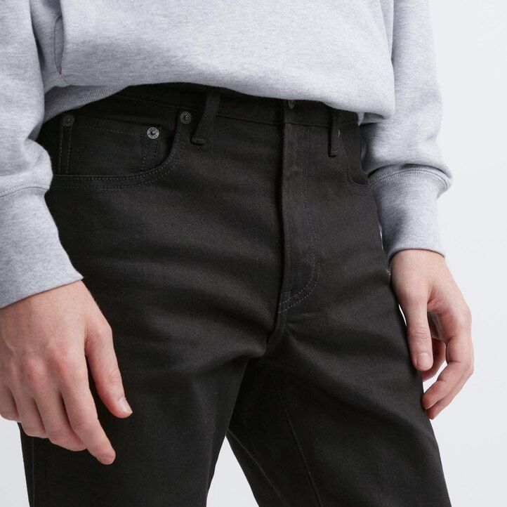 vaqueros ajustados elásticos con orillo uniqlo para hombre color negro