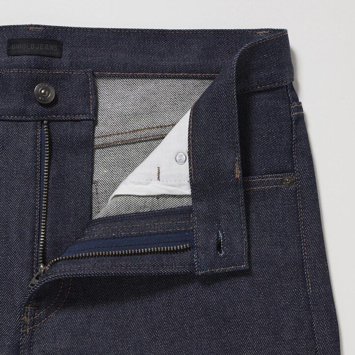 vaqueros ajustados elásticos con orillo uniqlo para hombre color negro