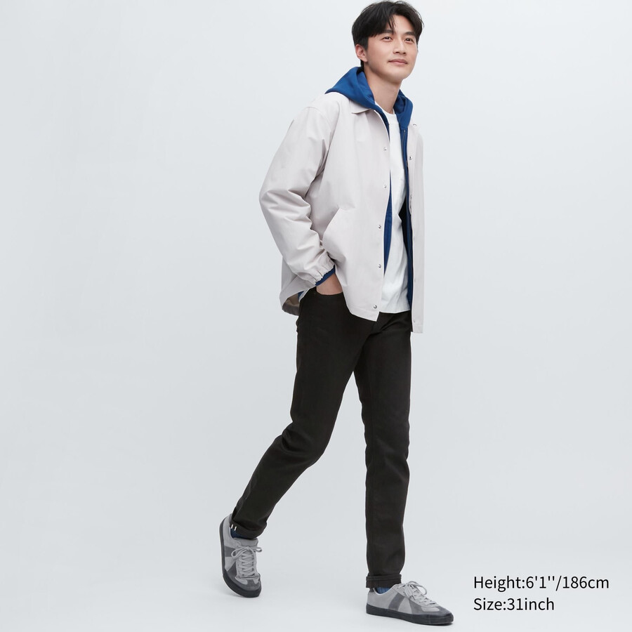 vaqueros ajustados elásticos con orillo uniqlo negros para hombre